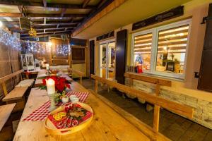 a dining room with a table with food on it at Bacówka u Winiarskich in Nowy Targ