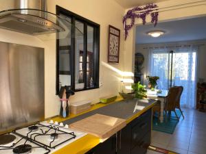 a kitchen with a stove and a counter top at Ty Ana in Ploubazlanec +7 photos