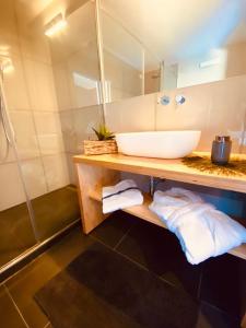 a bathroom with a sink and a mirror at La casina rossa Affittacamere in La Spezia