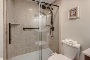 a bathroom with a shower and a toilet at Mountain Green, Condos at Killington in Killington +36 photos