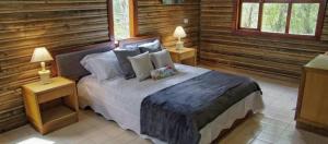 Postel nebo postele na pokoji v ubytování HOTEL IGUAIMA