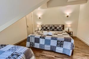 a bedroom with two beds and two lamps at Mountain Green, Condos at Killington in Killington