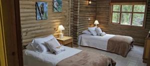Postel nebo postele na pokoji v ubytování HOTEL IGUAIMA