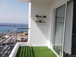 a balcony with a view of the ocean at Apartamento la estrella, los cristianos in Los Cristianos