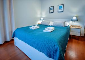 Posteľ alebo postele v izbe v ubytovaní Apartamenty na Wyspie - Baltic Park 3.0.7 - Apartament z 2 sypialniami i 80 m² tarasem