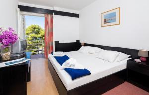 Letto o letti in una camera di Hotel Hvar