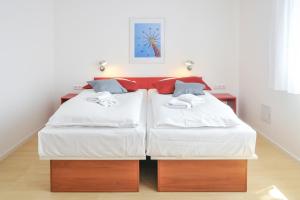 Giường trong phòng chung tại Gästehaus abz Stuttgart