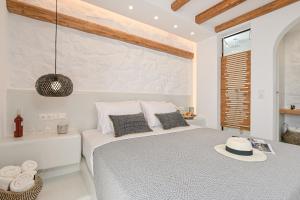A bed or beds in a room at Naxos Blue Sky