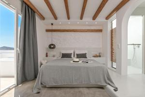 A bed or beds in a room at Naxos Blue Sky