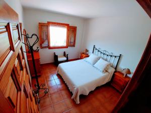 Ένα ή περισσότερα κρεβάτια σε δωμάτιο στο CAZORLA, CASA RURAL LA GUINDALERA +36 φωτογραφίες