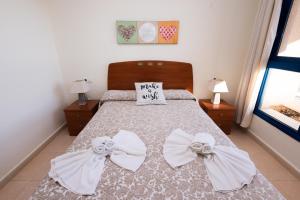 Voodi või voodid majutusasutuse Apartamento Cuellar 3 - PlusHolidays toas