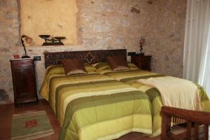 A bed or beds in a room at Mas del Joncar