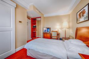Postel nebo postele na pokoji v ubytování Hotel Moosburger Hof