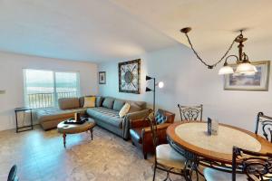 a living room with a couch and a table at Atlantico 32 in Daytona Beach