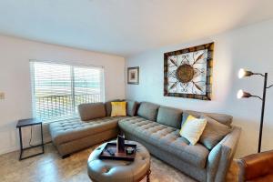 a living room with a couch and a table at Atlantico 32 in Daytona Beach