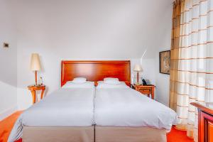 Postel nebo postele na pokoji v ubytování Hotel Moosburger Hof