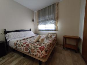 Postel nebo postele na pokoji v ubytování Calafell Sant Antoni