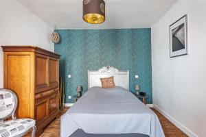 Postel nebo postele na pokoji v ubytování La Jeannette - maison avec jardin