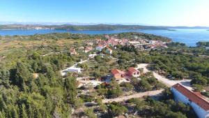 an aerial view of a small town on a lake at Apartments Irena in Božava