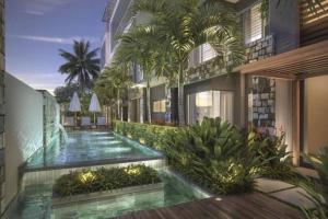 a rendering of a building with a swimming pool at Entire Luxury 3 BR condo for rent - Flic-en-Flac - Close to Beach in Flic-en-Flac
