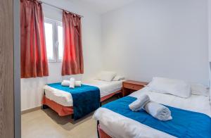 Postel nebo postele na pokoji v ubytování Casa del Sol