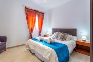 Postel nebo postele na pokoji v ubytování Casa del Sol