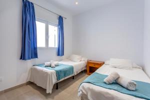 A bed or beds in a room at Casa del Sol