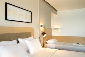 Posteľ alebo postele v izbe v ubytovaní Margarita Sea Side Hotel