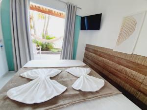 Postel nebo postele na pokoji v ubytování Pousada Mar da Gamboa