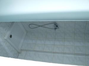 
a shower curtain is hanging from a wall at Carina Hotel in Rhodes Town
