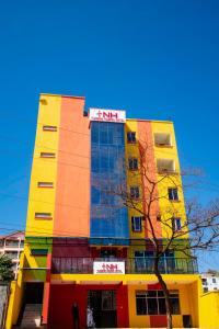 a building with colorful paint on the side of it at Turbine Ngong Hotel in Ngong