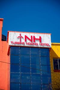 a sign on the top of a building at Turbine Ngong Hotel in Ngong
