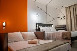 מיטה או מיטות בחדר ב-Front Comfort Teófilo Otoni