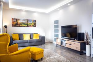 Televiisor ja/või meelelahutuskeskus majutusasutuses SCANDIC Apartments Plešivec