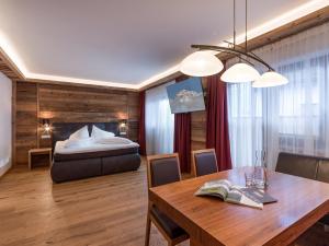 Voodi või voodid majutusasutuse Tennenwirt Hotel toas