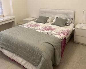 a bedroom with a large bed with pillows on it at Stylish Ground floor 3-Bed Apartment in Dalyan in Ortaca