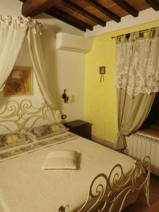 Posteľ alebo postele v izbe v ubytovaní Agriturismo Palazzo Conti A + 37 fotografií