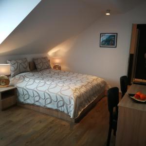a bedroom with a large bed in a attic at Wachtendonker Hof in Wachtendonk