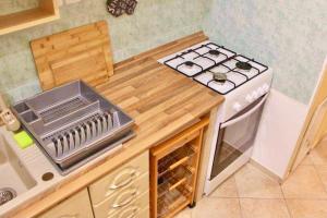 A kitchen or kitchenette at Relax Wellness Apartman