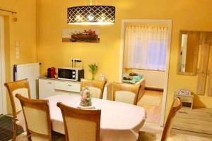 A kitchen or kitchenette at Relax Wellness Apartman