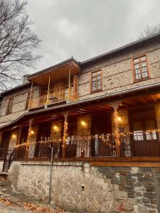 a large building with a porch and a balcony at 11 Luxury Apartments Metsovo. in Metsovo