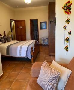 A bed or beds in a room at The Hacienda Apartment