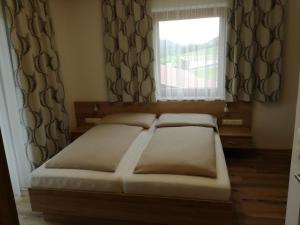 Letto o letti in una camera di Haus Alpenfriede