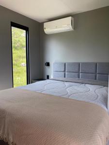 Una cama o camas en una habitación de Leão da Montanha - Hospedaria Rural