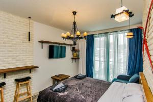 Ένα ή περισσότερα κρεβάτια σε δωμάτιο στο M25 Bakuriani, Apartment 415