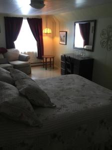 Ein Bett oder Betten in einem Zimmer der Unterkunft Gîte la Veilleuse