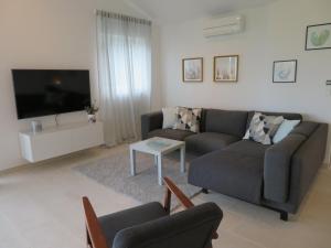 Televízia a/alebo spoločenská miestnosť v ubytovaní Korčula - apartman 1, Prigradica - IVAN