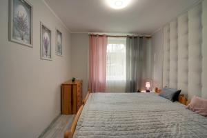 Posteľ alebo postele v izbe v ubytovaní Apartamenty u Zosi