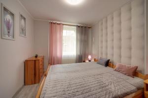 Posteľ alebo postele v izbe v ubytovaní Apartamenty u Zosi