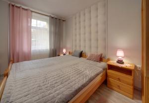 Posteľ alebo postele v izbe v ubytovaní Apartamenty u Zosi